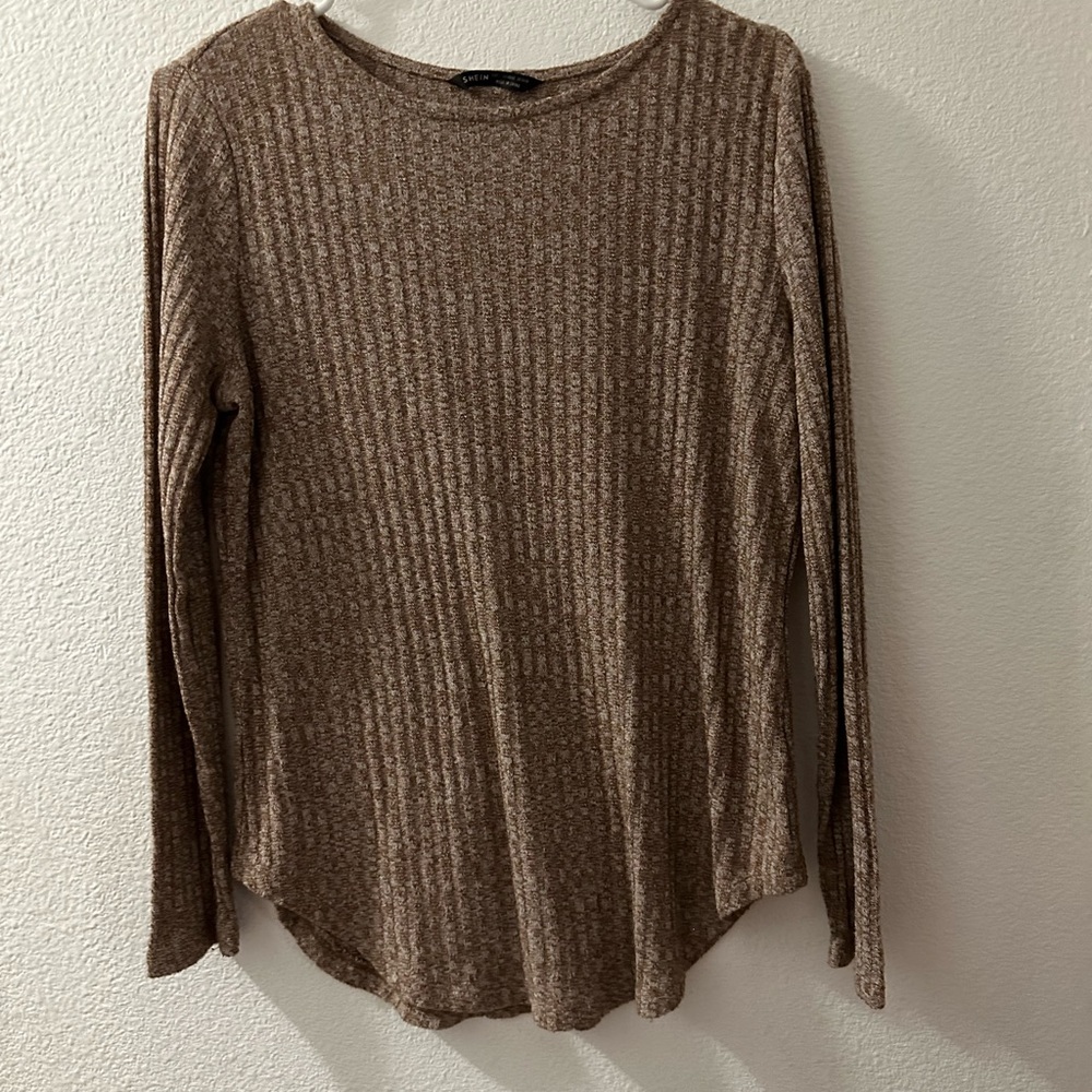 Tan long sleeve shirt. Size L. Button detailing on back.
